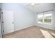 This bedroom has neutral carpet, paint, a window for natural light, and a ceiling fan at 11618 Colony Lake Dr, Tampa, FL 33635