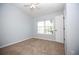 Bedroom features a ceiling fan and carpet with natural light from a window at 11618 Colony Lake Dr, Tampa, FL 33635