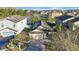 Aerial view of home showcasing a brick driveway and mature landscaping at 12523 Longstone Ct, New Port Richey, FL 34655
