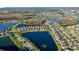 An aerial view showcasing a community with multiple lakes and trees that enhance the scenery at 12523 Longstone Ct, New Port Richey, FL 34655