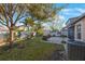 This beautiful backyard features a brick patio, lush green grass, trees and plenty of space to entertain at 12523 Longstone Ct, New Port Richey, FL 34655