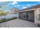 Backyard patio with pavers and a screened-in porch at 12523 Longstone Ct, New Port Richey, FL 34655