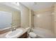 Bathroom featuring a tub/shower, vanity, and tile surround at 12523 Longstone Ct, New Port Richey, FL 34655