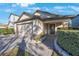 Well-maintained home with brick-paved walkway, stone-lined flowerbeds, and an attached two-car garage at 12523 Longstone Ct, New Port Richey, FL 34655