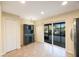 Bright eat-in kitchen with backyard views, dark cabinetry and tile flooring at 12523 Longstone Ct, New Port Richey, FL 34655
