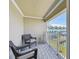 Relaxing balcony with seating overlooking a canal offers serene outdoor space at 156 117Th Ave, Treasure Island, FL 33706