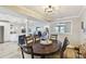 Open floor plan: a view from dining room to the kitchen and sitting area, with plenty of space at 156 117Th Ave, Treasure Island, FL 33706