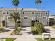 Charming townhome featuring a private garage and well-manicured landscaping at 156 117Th Ave, Treasure Island, FL 33706