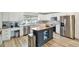 Modern kitchen with stainless steel appliances and a bright window at 156 117Th Ave, Treasure Island, FL 33706