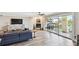 Comfortable living room featuring a fireplace, modern decor, and sliding doors to a private balcony at 156 117Th Ave, Treasure Island, FL 33706