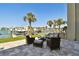 Inviting patio with seating offers tranquil views of waterfront and dock at 156 117Th Ave, Treasure Island, FL 33706