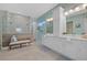 Bright bathroom with double vanity, glass shower, and bench seating at 15909 39Th E Gln, Parrish, FL 34219