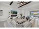 Stylish living room featuring a modern fireplace, decorative shelving, and comfortable seating at 15909 39Th E Gln, Parrish, FL 34219