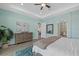 Bright main bedroom features recessed lighting, en-suite bath, and wood-look flooring at 15909 39Th E Gln, Parrish, FL 34219