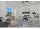 Bright office space featuring a large window, modern desk, and stylish decor at 15909 39Th E Gln, Parrish, FL 34219