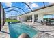 Outdoor pool area featuring a spa, brick pavers, and a relaxing lake view at 15909 39Th E Gln, Parrish, FL 34219