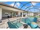 Outdoor pool area featuring a spa, brick pavers, and a relaxing lake view at 15909 39Th E Gln, Parrish, FL 34219