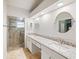 Bathroom with double sinks, granite countertops, glass enclosed shower at 1603 E Del Webb Blvd, Sun City Center, FL 33573