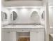 Bathroom featuring dual sinks, granite countertops and wood look floors at 1603 E Del Webb Blvd, Sun City Center, FL 33573