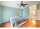 Bedroom featuring wood floors, and a walk in closet at 1603 E Del Webb Blvd, Sun City Center, FL 33573