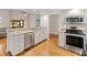 Modern kitchen featuring stainless steel appliances, granite countertops, and hardwood floors at 1603 E Del Webb Blvd, Sun City Center, FL 33573