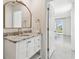 Elegant bathroom with marble countertop and gold fixtures at 16614 Mosaic Oar Dr, Wimauma, FL 33598