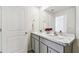 Bathroom featuring a double vanity with marble countertop, gray cabinets, and neutral flooring at 16614 Mosaic Oar Dr, Wimauma, FL 33598