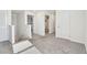 Upstairs hallway with carpet flooring and doors leading to bedrooms and bathrooms at 16614 Mosaic Oar Dr, Wimauma, FL 33598