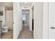 Hallway view with bathroom on the left and a view to the living area at 16614 Mosaic Oar Dr, Wimauma, FL 33598