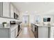 Spacious kitchen boasting granite countertops, stainless steel appliances and an open layout at 16614 Mosaic Oar Dr, Wimauma, FL 33598