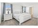 Inviting main bedroom featuring carpet flooring and matching nightstands with lamps at 16614 Mosaic Oar Dr, Wimauma, FL 33598