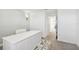 Well-lit office with white desk, light walls, and decorative wall sconces at 16614 Mosaic Oar Dr, Wimauma, FL 33598