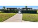 Community pool area with pergola and manicured landscaping at 16614 Mosaic Oar Dr, Wimauma, FL 33598