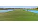 Community tennis courts with well-maintained green and blue playing surfaces for active lifestyles at 16614 Mosaic Oar Dr, Wimauma, FL 33598
