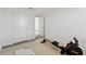 The home gym features a rowing machine, light colored puzzle piece flooring, and a yoga mat at 16614 Mosaic Oar Dr, Wimauma, FL 33598