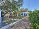 Expansive backyard featuring a stepping stone pathway and lush foliage at 1700 30Th N Ave, St Petersburg, FL 33713