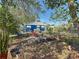 Spacious backyard with patio furniture, lush greenery, and mature trees at 1700 30Th N Ave, St Petersburg, FL 33713