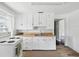 Bright kitchen featuring white cabinetry, light countertops and classic appliances at 1700 30Th N Ave, St Petersburg, FL 33713