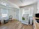 Cozy kitchen with tiled floors, white cabinets, and view to backyard at 1700 30Th N Ave, St Petersburg, FL 33713