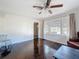 Light-filled living room with hardwood floors and a ceiling fan at 1700 30Th N Ave, St Petersburg, FL 33713