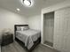 Cozy bedroom features a comfortable bed and closet for ample storage at 1913 Park Ave, Tarpon Springs, FL 34689