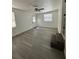 The bonus room has durable floors, windows, and an exit to the exterior at 1913 Park Ave, Tarpon Springs, FL 34689