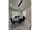Dining room showcasing a glass table with six chairs, and modern lighting fixture at 1913 Park Ave, Tarpon Springs, FL 34689