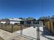 This charming home boasts a freshly landscaped yard and a secure fenced perimeter at 1913 Park Ave, Tarpon Springs, FL 34689