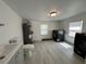 Bright laundry room featuring modern washer and dryer, complemented by neutral walls and flooring at 1913 Park Ave, Tarpon Springs, FL 34689