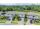 Suburban homes surrounded by lush trees, neatly manicured lawns, and paved driveways in a vibrant neighborhood at 19445 Redwood Point Dr, Tampa, FL 33647