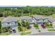 Suburban homes surrounded by lush trees, neatly manicured lawns, and paved driveways in a vibrant neighborhood at 19445 Redwood Point Dr, Tampa, FL 33647