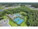 Aerial view of community pool, tennis courts, playgrounds and surrounding residential area at 19445 Redwood Point Dr, Tampa, FL 33647