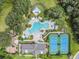 Overhead view of community pool, tennis courts, playgrounds, green areas, and picnic pavilion at 19445 Redwood Point Dr, Tampa, FL 33647