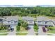 Suburban homes surrounded by lush trees, neatly manicured lawns, and paved driveways in a vibrant neighborhood at 19445 Redwood Point Dr, Tampa, FL 33647
